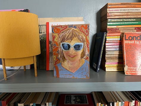 Photos of disorganised Artist book shelves and
