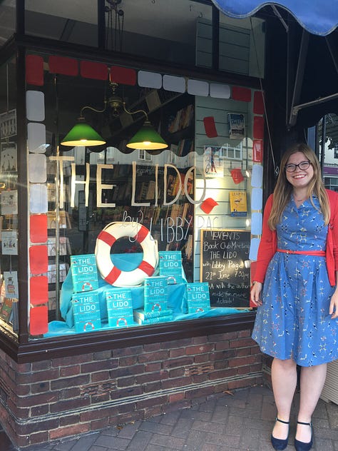 A gallery of photos of Libby promoting her first novel, The Lido, including photos of her holding her book, a newspaper review and pointing at her book in bookshops.