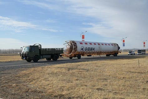 Vehicle hardware for the Long March 2D Y101 mission being transported to and stacked on the launch pad.