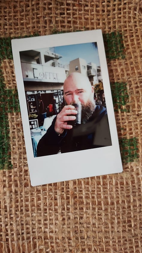 A collage of instant photographs of coffee mugs or a bald, bearded, white man drinking coffee.