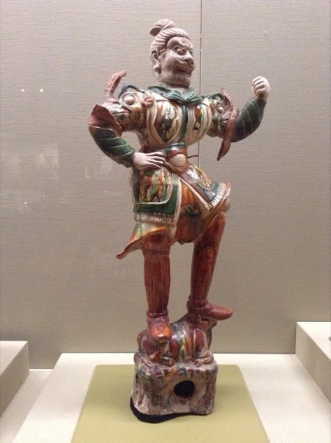 Japanese armour, a statue and a painting of man on horse