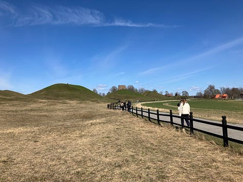 Two course images and one of the humps of the Royal Mounds North of the city