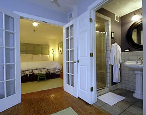breakfast room, view of street scene, en suite room, fireplace, cozy bed