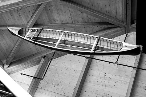 Suspended canoes in main lobby.