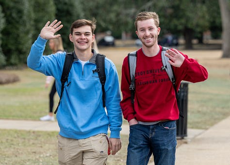 Students walk across the Troy campus heading to class