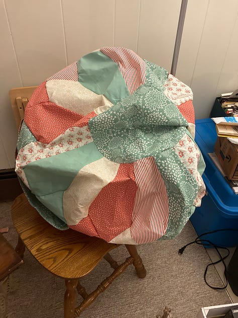 a series of six photos showing the progress of the 30 inch ottoman pouf including a shot of the thread wrapped around the bobbin holder of the sewing machine
