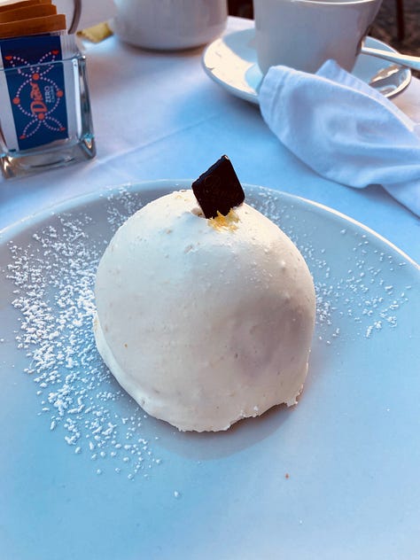 Images of a pastry known as Lemon Delight made in Amalfi, Italy. About the size of a tennis ball it is white in colour with a piece of chocolate on top. 