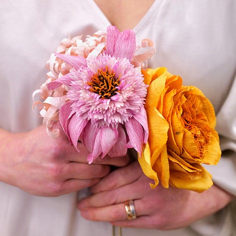 Three colourful arrangements of paper flowers in bright colours :vibrant poppies in shades of burgundy, blush and orange; Roses and Echinacea in soft natural colours created with onion skins and madder; anemones, tulips and dahlia in vivid aquas, mixed with real eucalyptus stems