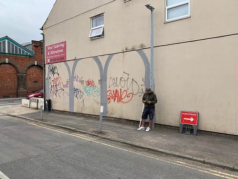 Art mural, artist's painting grey arches.