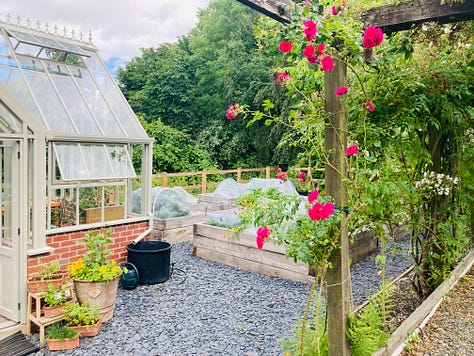 Joy, woods, beach, pink flowers, white boots, a greenhouse