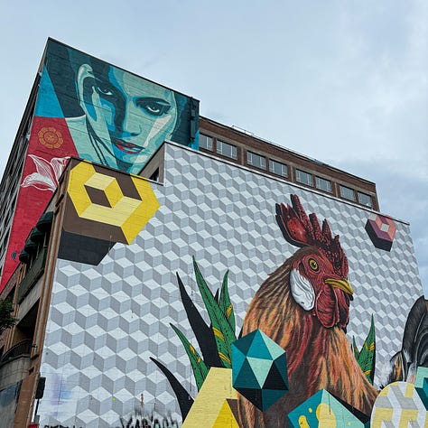 three colorful murals painted on buildings