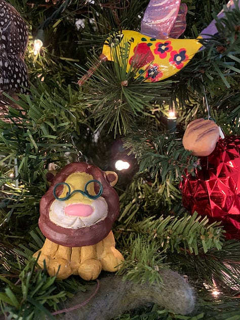hand crafted ornaments for 2023 by Kayla Stark and Brad Henderson of a lion and a snail