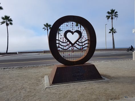 Heart sculpture in Oceanside, California with 3 pictures, one showing a close up of the locks, one of the sculpture with many locks and one with just a few locks when the sculpture was first installed.