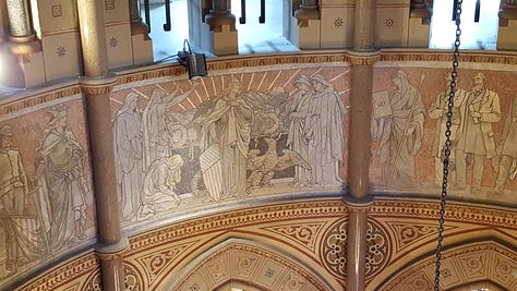 From left: Garfield's statue in the atrium. A fresco depicting a personification of Liberty. The external frieze depicting Garfield at center.