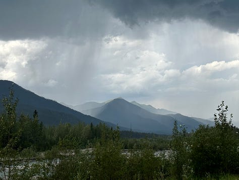 Images of a Smoky orange sunset, epic downpour, and a double rainbow