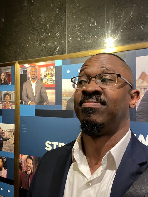 NBC employee ID, Joshua with Lester Holt, Joshua with Joy Reid, New Hampshire Primary ID badge, Joshua wearing badge, Joshua next to his picture in a promotional poster for NBC News NOW, 30 Rock lit up on Election Night 2020, Joshua at the MSNBC anchor desk during COVID-19 coverage