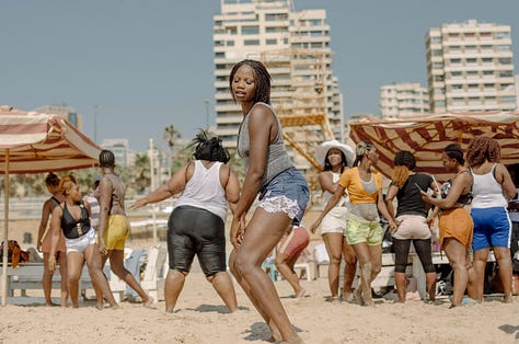 Aline Deschamps' photos of exploited African women enjoying a moment of freedom at the beach in Beirut.