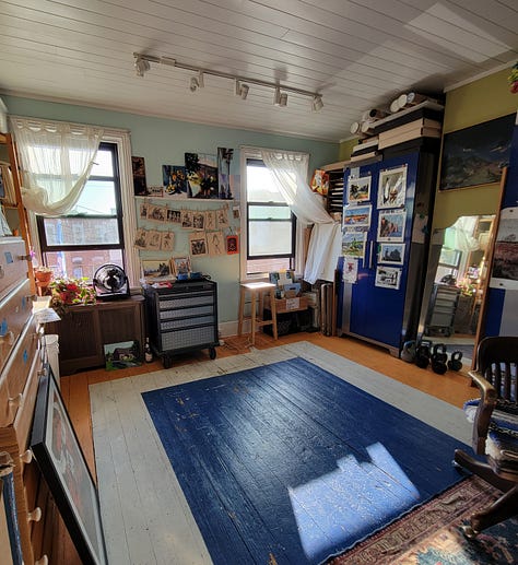 image of the studio, two friends with artworks, and a bag of art materials from Artist and craftsman