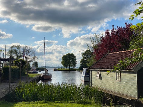 Small harbors, bridges, and shops in varying villages of Friesland, Netherlands.