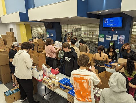 Stafford High School students pack and load meal kits for delivery to county schools. The service learning project was enabled by a $17,000 from Giant Food. Photos courtesy Stafford County Public Schools.