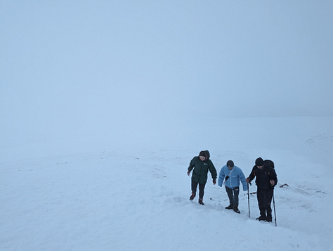 Sunset walk on Pen y Fan in winter with snow 