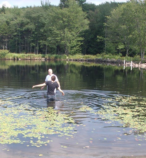 The author being baptized in a lake in summer, 2011.