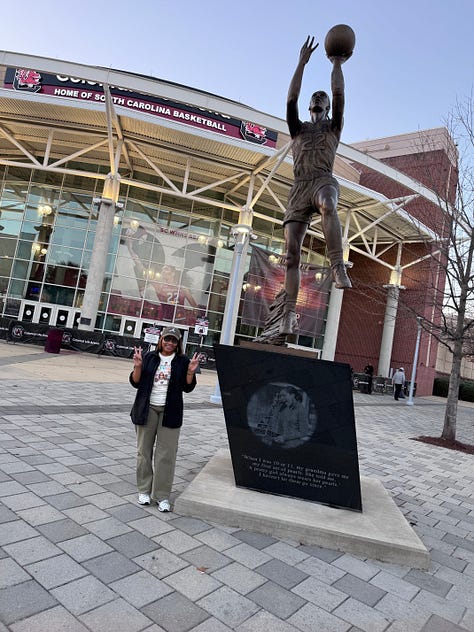Me and A'ja's statue; custom art of A'ja; Dawn Staley, the artist of the painting shown, and A'ja; poster from the event I attended; A'ja decal on the arena; me and Janel; posing in my A'One shirt; A'ja's retired jersey; Dawn Staley Way