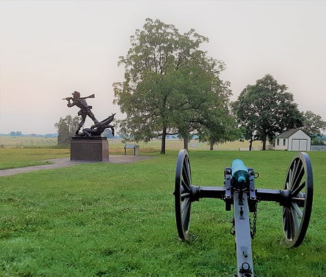 The Mississippi Monument on the Gettysburg battlefield showing a soldier holding his rifle like a club to defend a fallen color bearer.