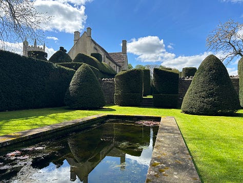 Westwood Manor, Bradford on Avon, Wiltshire. A topiary house leads to the garden and two ponds.