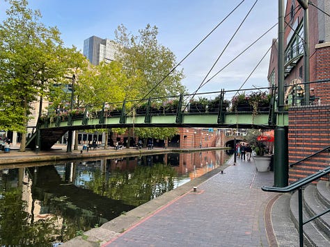 Various pictures of transport in the UK's second city. They include trams, excellent public spaces, hire bikes, Birmingham New Street Station, and Black Sabbath