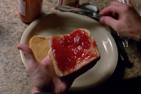 Bryan Cranston’s Walter White cutting of the crusts of his white bread peanut butter and jelly sandwich in Breaking Bad, cutting off crusts like the lovable maniac he is. 