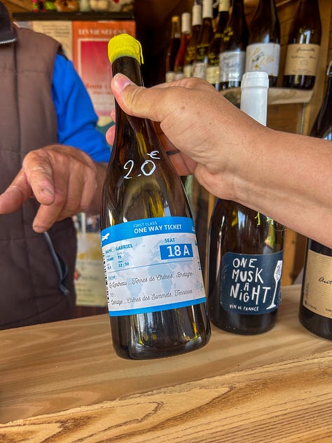 Wine glasses and bottles at a roadside wine stand