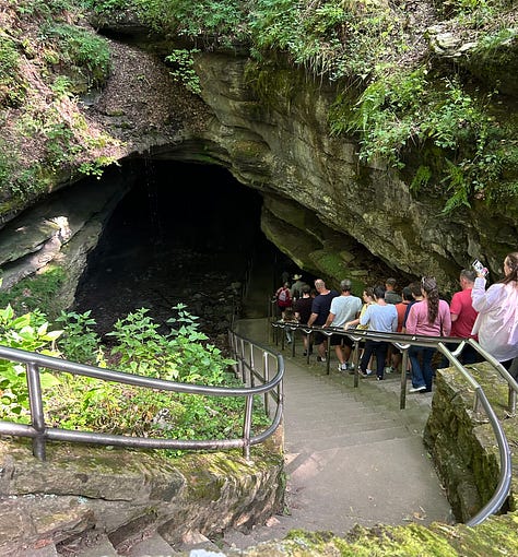 Three images show Nicole's trip into Mammoth Cave. In the first, a large group of people descend around 100 steps into the cave. In the second, the dimly lit Mammoth Passage is visible, with a group of tour-takers experiencing the view. In the third image, Nicole's pink Vans slip-ons step on a sudsy, black mat.