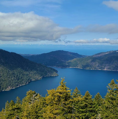 Views of a lake from the top of a mountain in Washington state on the Olympic Peninsula.