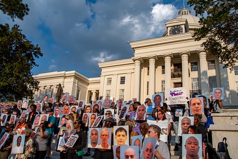 Citizens gather for a vigil to remember loved ones who have died in Alabama's prisons