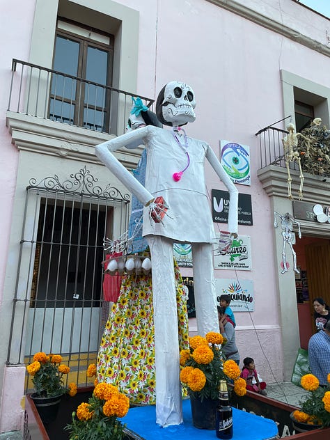 A nine image collage showing elaborate Día de Muertos decorations in the city.