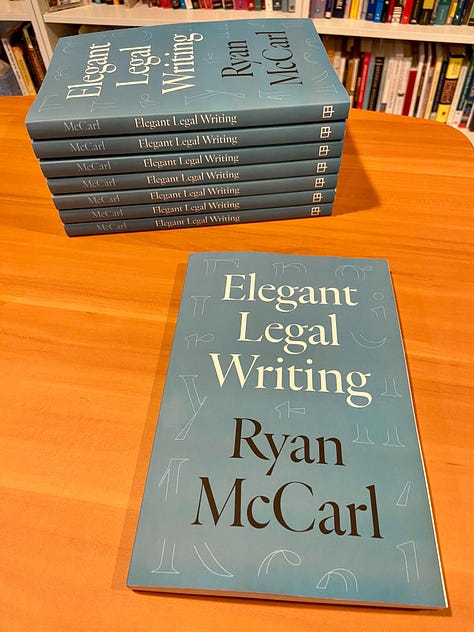 Ryan McCarl, author of Elegant Legal Writing, shows the advance review copies of the book that just arrived from the UC Press.