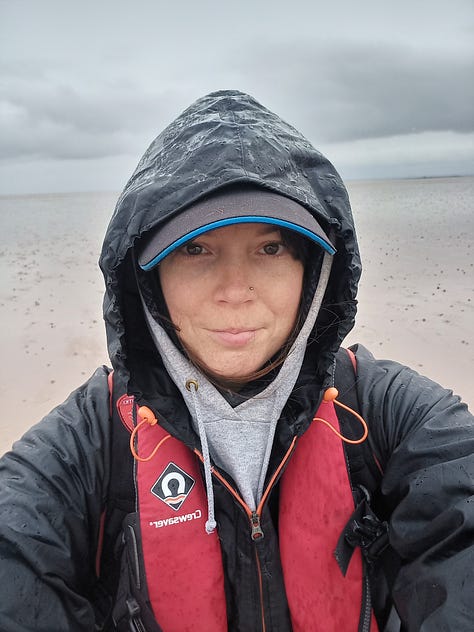 A row of tanks in a utility room; containers of seed balls; expanse of tidal mudflat; seed pillows piled up on beach; selfie with waterproofs and layers; two people with pottiputkis.