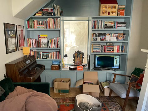 Photos of disorganised Artist book shelves and