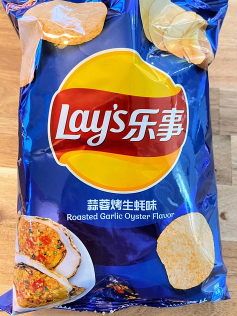 Left: Lays Cucumber flavor potato chip bag; Middle: Lays Roasted Garlic Oyster flavor potato chip bag; Right: Lays Magic Masala chip bag
