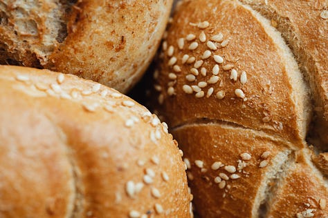 a row of three photos showing Belgian style bread rolls, 1st on a marble background with cream cheese, 2nd in bread basket, 3rth close-up of kaiser bun