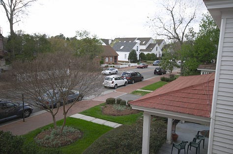 breakfast room, view of street scene, en suite room, fireplace, cozy bed