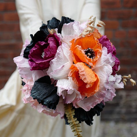 Three colourful arrangements of paper flowers in bright colours :vibrant poppies in shades of burgundy, blush and orange; Roses and Echinacea in soft natural colours created with onion skins and madder; anemones, tulips and dahlia in vivid aquas, mixed with real eucalyptus stems
