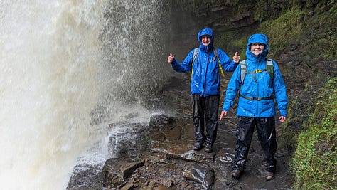 two hikers in the waterfalls area of the brecon beacons