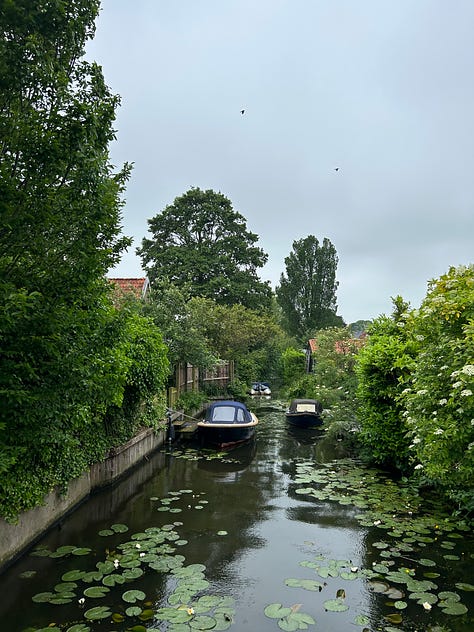 Small harbors, bridges, and shops in varying villages of Friesland, Netherlands.