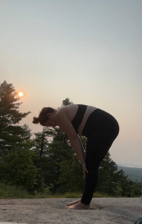 A gallery of images shows a woman standing on a mountain top with the rising sun in the background doing a series of yoga poses.