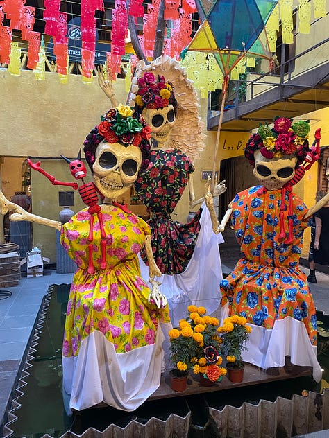 A nine image collage showing elaborate Día de Muertos decorations in the city.