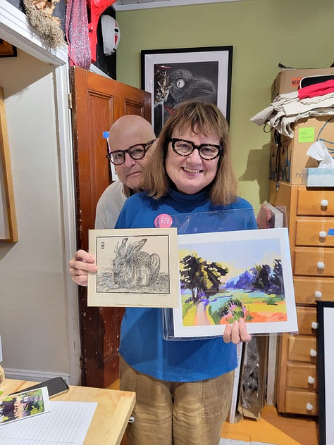 image of the studio, two friends with artworks, and a bag of art materials from Artist and craftsman