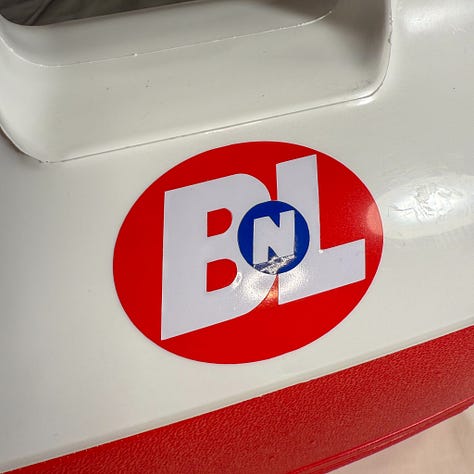 White and red igloo cooler with Buy N Large stickers