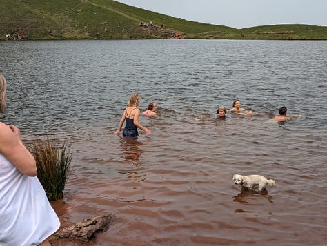 wild swimming on pen y fan in the brecon beacons